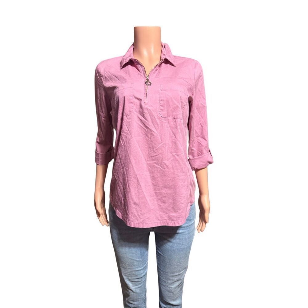 Emily Daniel’s women's pink collared shirt with a half-zip neckline and two ches